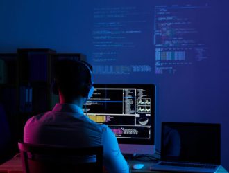 rear view programmer working all night long e1646310129800
